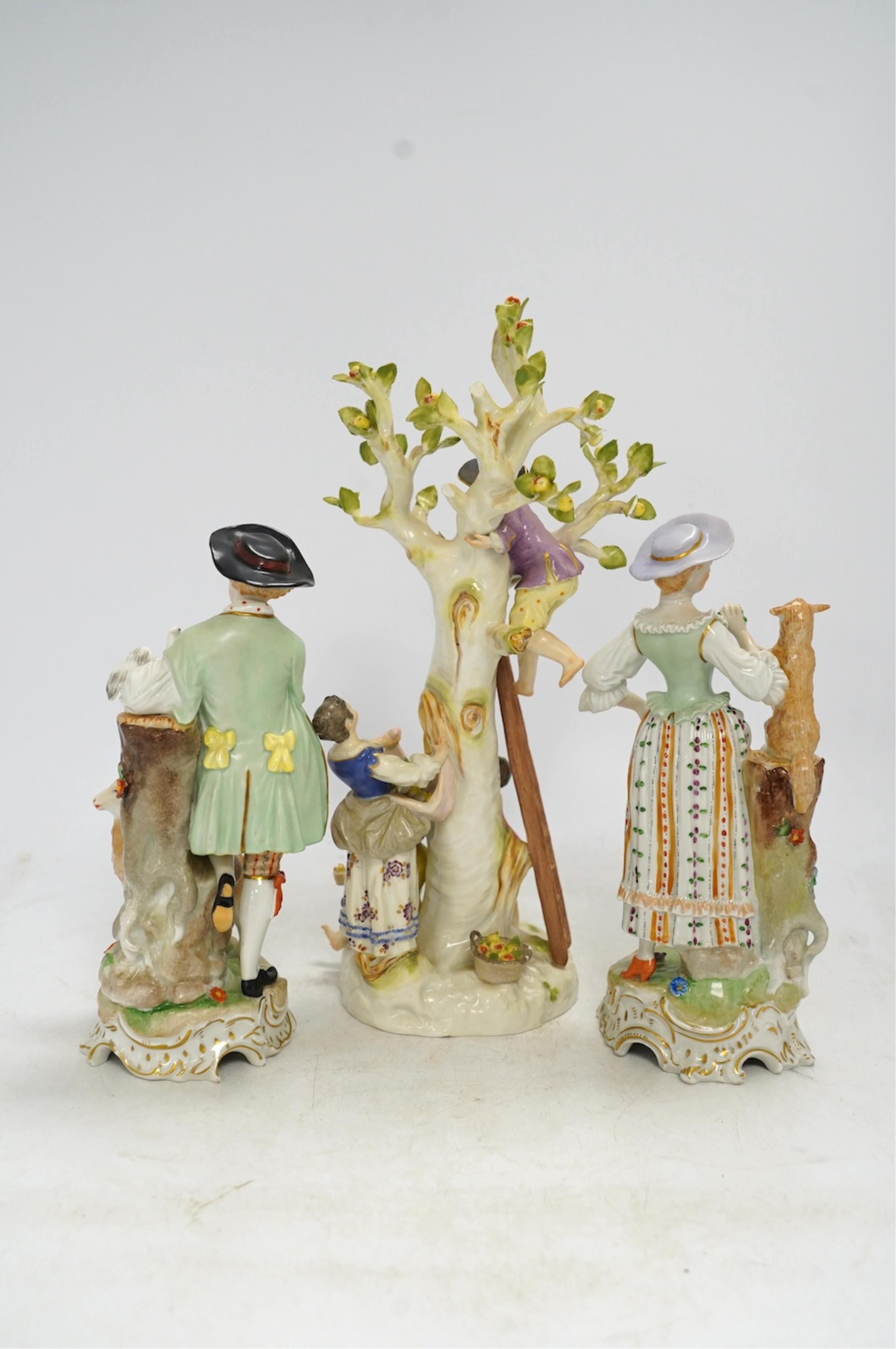 A Meissen apple pickers figure group and a pair of Dresden porcelain groups, tallest 29cm. Condition - some damage